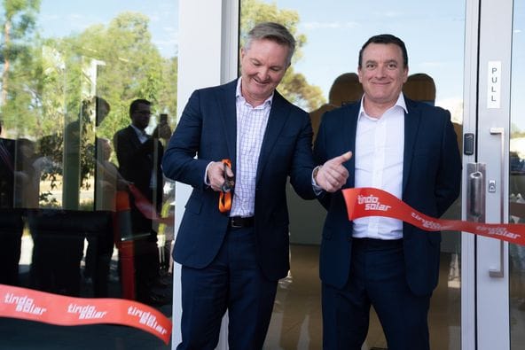 Energy Minister Chris Bowen cutting a tindo solar r