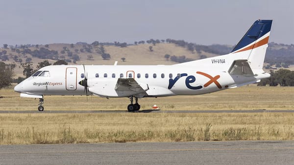 A Rex Airlines flight on a regional runway.