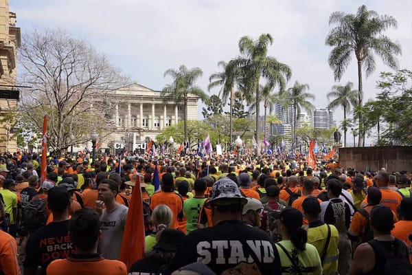 Union members marching in Brisbane's CBD.