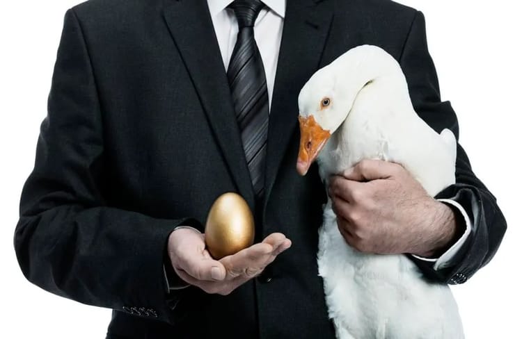 Politician holding a goose that lays golden eggs.